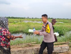 Wujudkan Pilkada Damai, Kapolsek Bonai Darussalam Giat Cooling System Dan Bansos