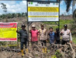 Polsek Rambah Samo Pasang Plang Peringatan di Lahan Bekas Terbakar, Warga Diingatkan Bahaya Karhutla